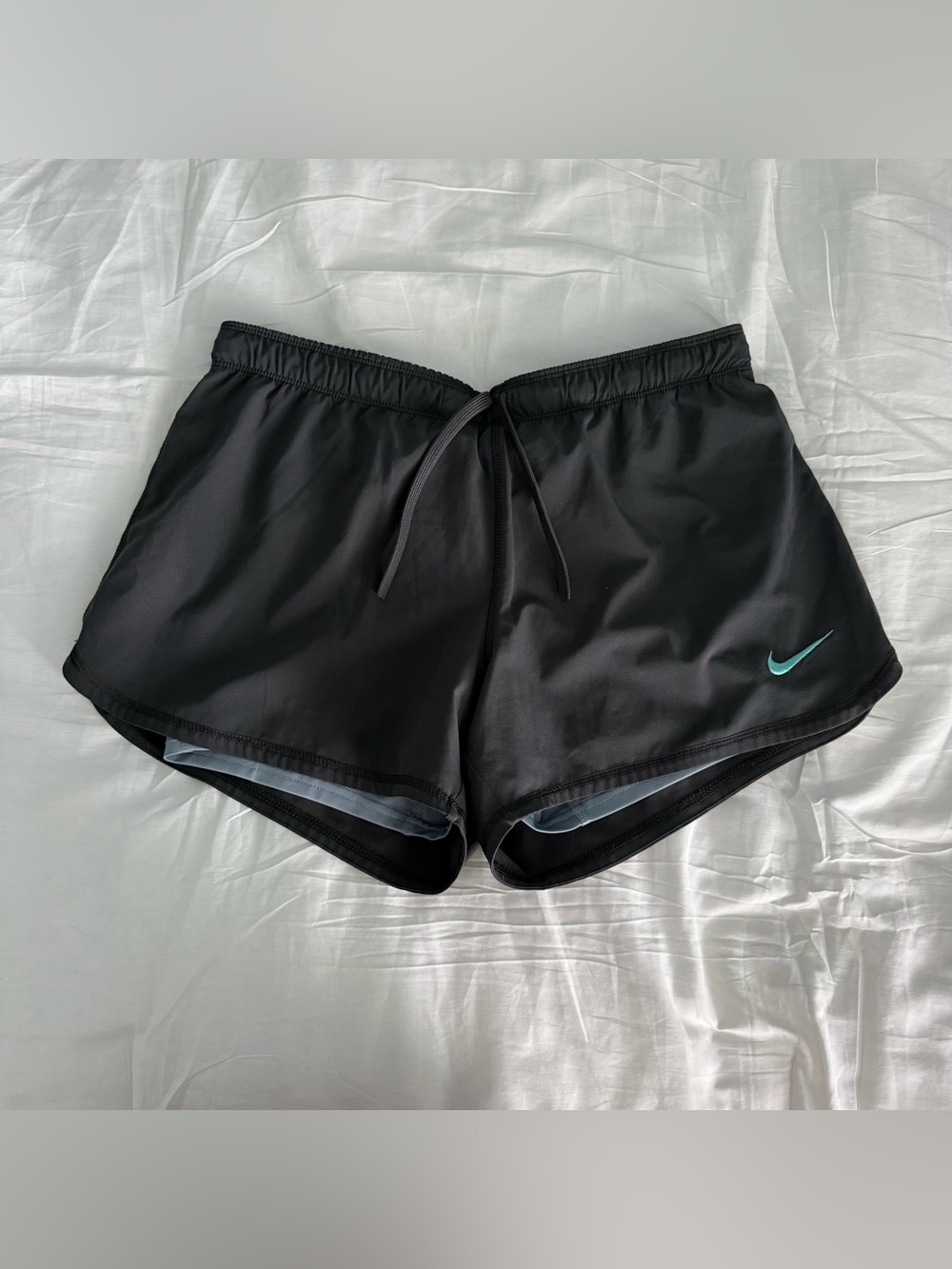Nike Women's Dark Grey Athletic Shorts with Teal Swoosh